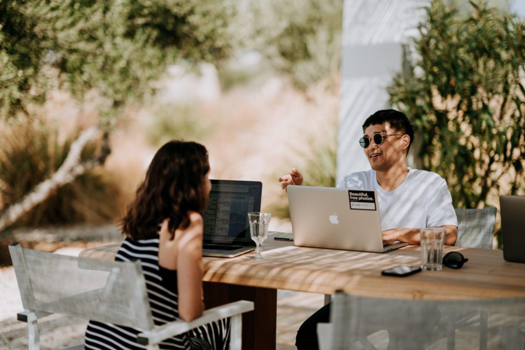 Couple working at cafe